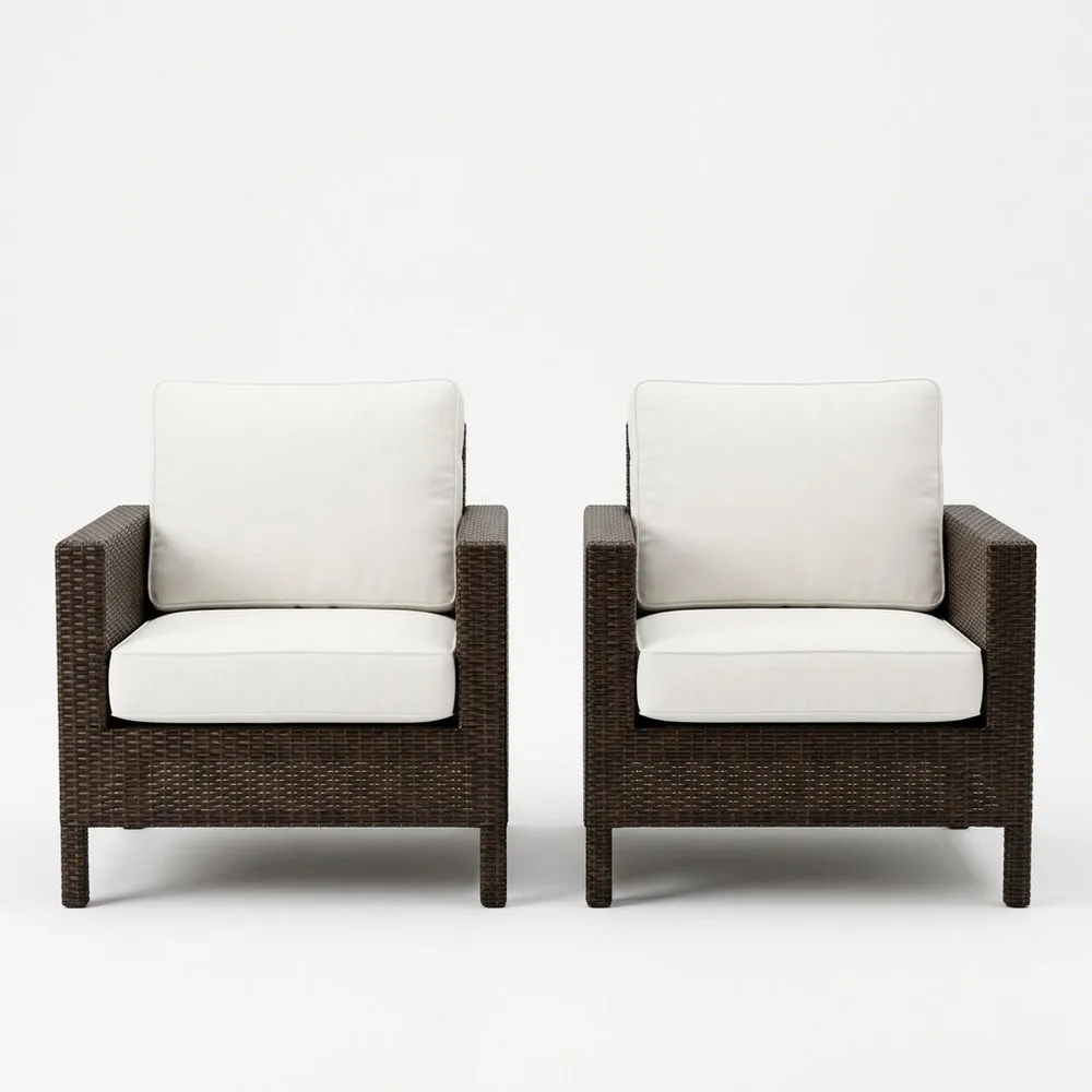 Juego de 2 sillones de ratán sintético marrón con cojines blancos