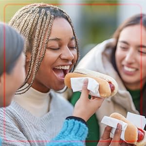 People eating hot dogs