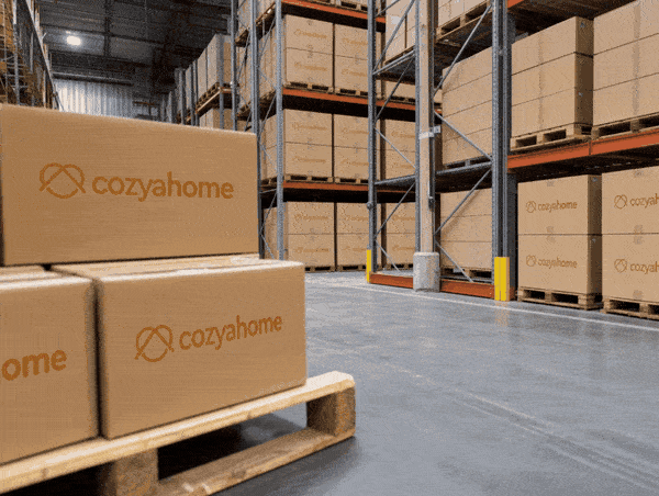 Warehouse shelves stacked with sealed product boxes