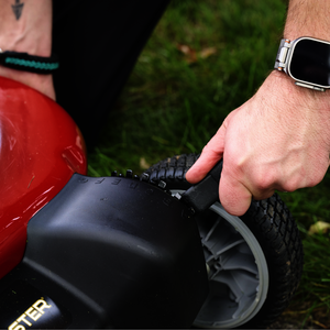 Toro TimeMaster mower - close up on the lever adjusting the wheel height