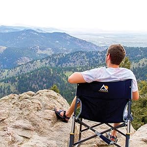 Man enjoying the view sitting on a GCI Outdoor chair