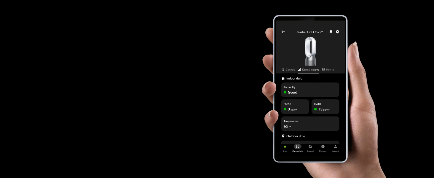Hand holding mobile device with the MyDyson app on the screen