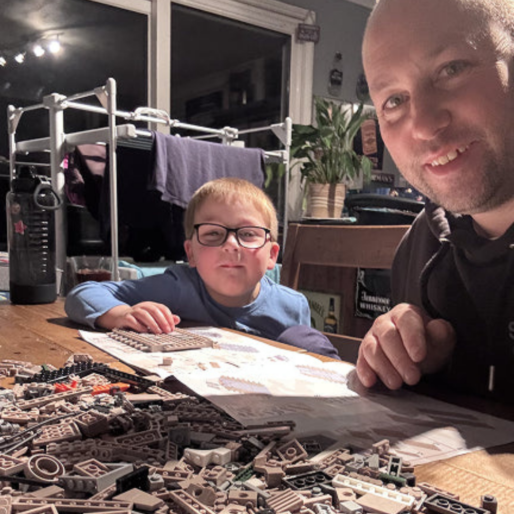 A dad and son building together