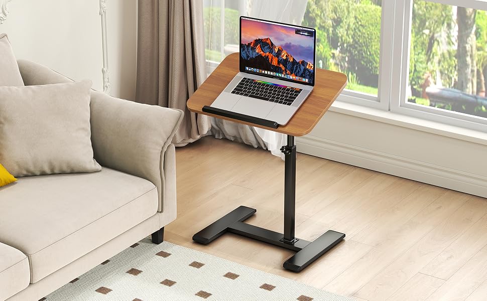 Adjustable laptop desk stand shown in home setting. Multiple images demonstrate product's flexibility in different positions next to sofa and as mobile workstation.