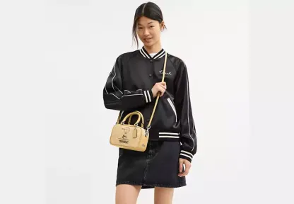 Coach X Peanuts Satchel Crossbody Bag In Signature Canvas With Charlie Brown