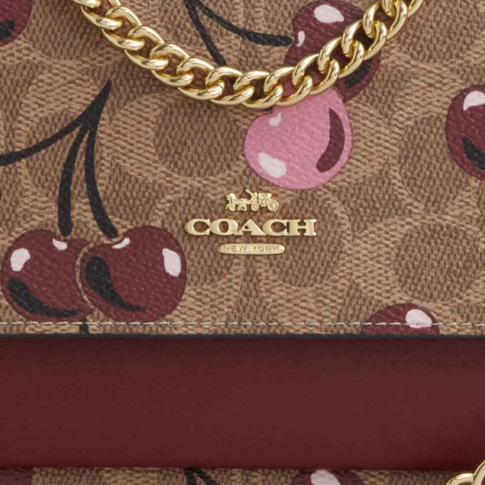 Mini Klare Crossbody Bag In Signature Canvas With Cherry Print