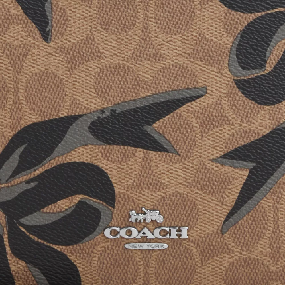Slim Crossbody Bag In Signature Canvas With Bow Print