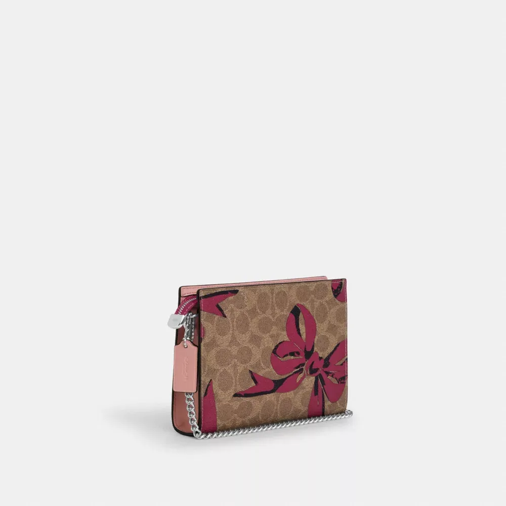 Slim Crossbody Bag In Signature Canvas With Bow Print