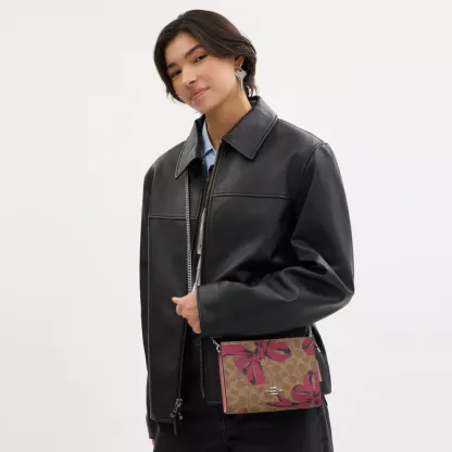 Slim Crossbody Bag In Signature Canvas With Bow Print