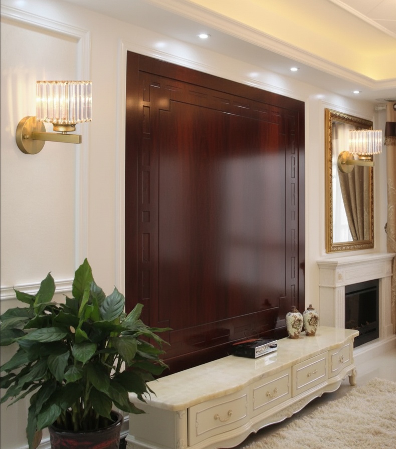 Crystal wall lamp illuminating hallway