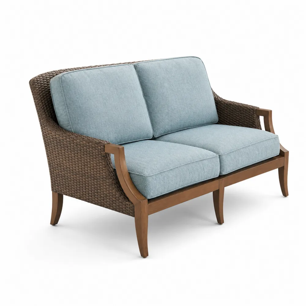 Dwuosobowa sofa rattanowa z niebieskimi poduszkami