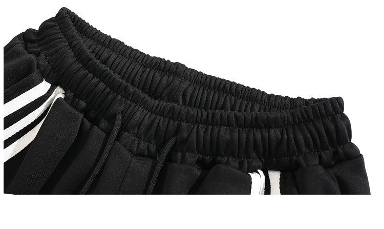 Black pants with white stripes on a white background