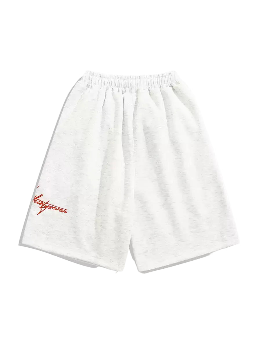 White shorts with red branding on a white background