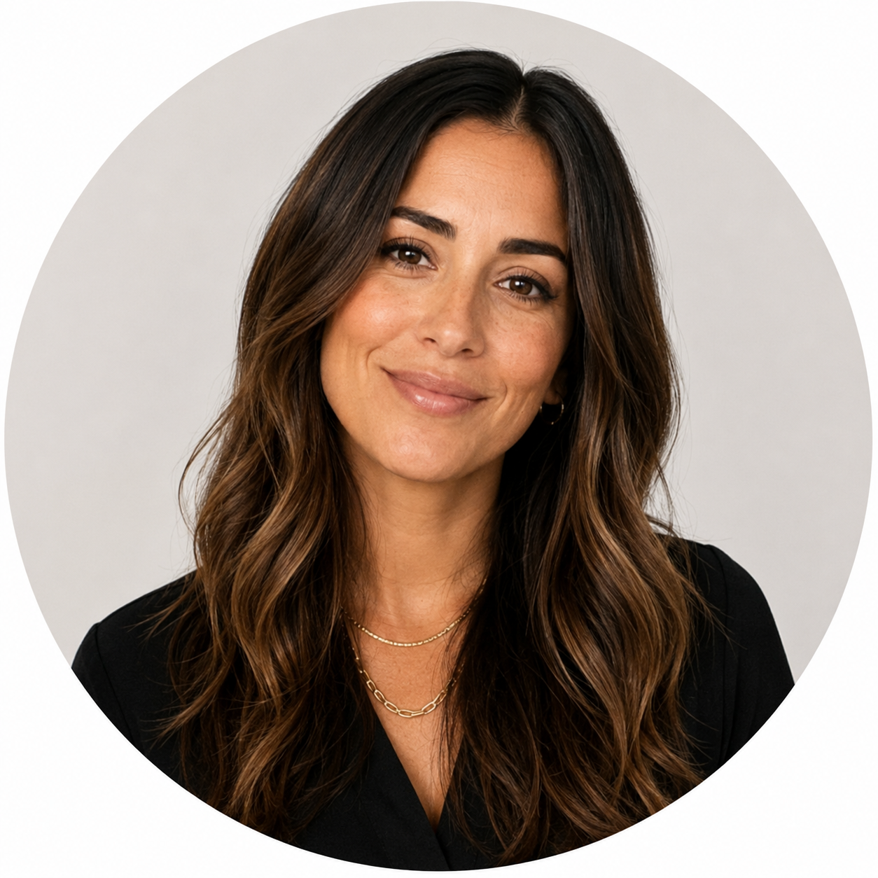Replace with a circular headshot of a female hair-care editor or stylist on a clean neutral background
