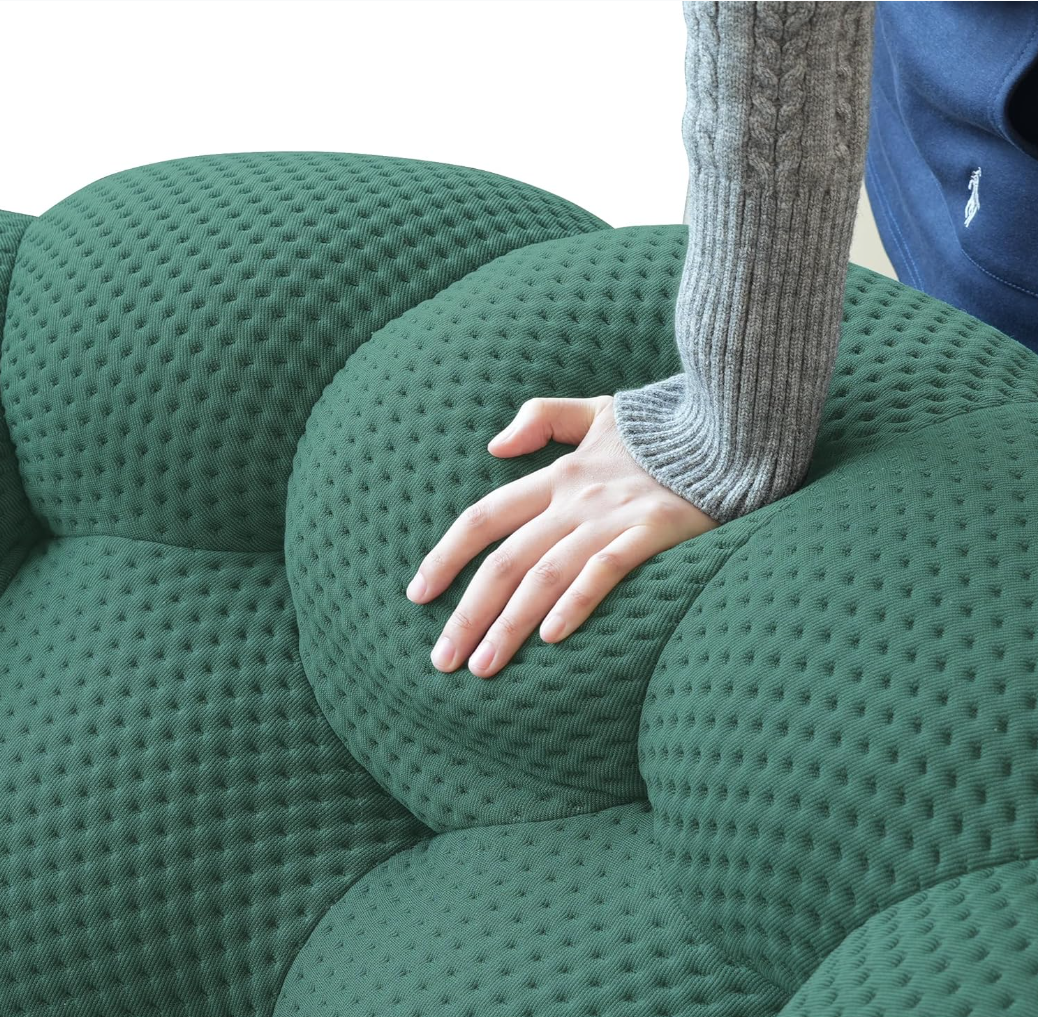 Soft resilient bubble sofa cushion with plush foam padding showing satisfying rebound after pressing, cloud-like cozy relaxation