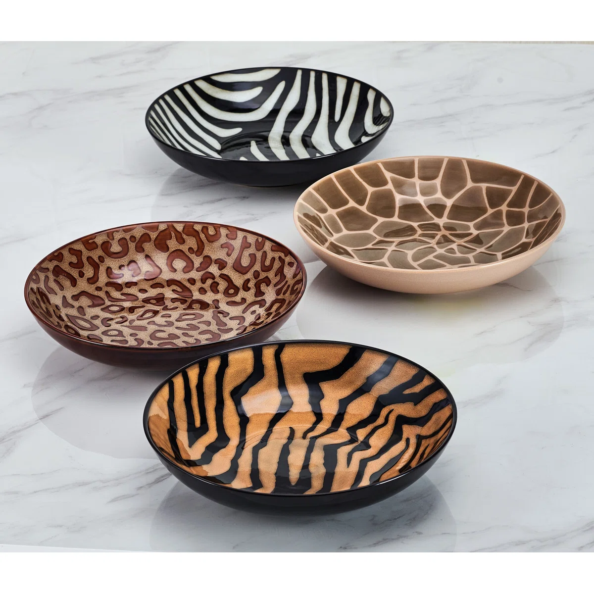 Close-up of animal print bowl patterns showing cheetah zebra tiger giraffe designs