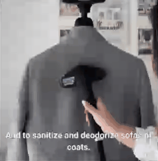 Steaming a coat on the stand