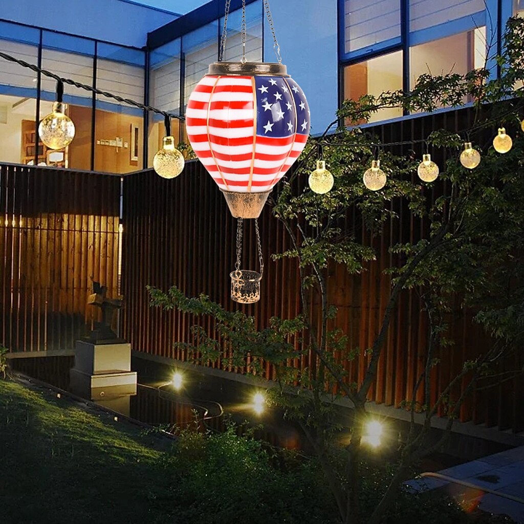 Patriotic-themed hot air balloon solar-powered Fourth of July lanterns, perfect for festive decorations in gardens, yards, and patios