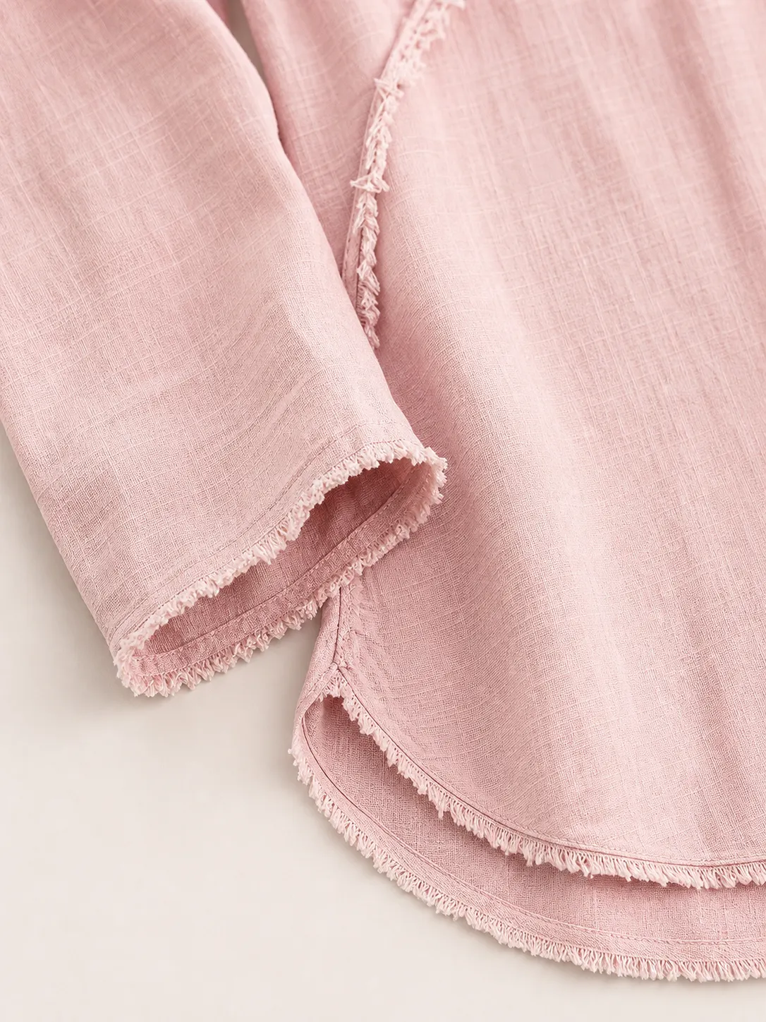 Fringe Cuff and Curved Hem Detail