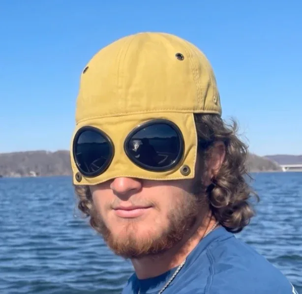 Customer wearing yellow goggle cap