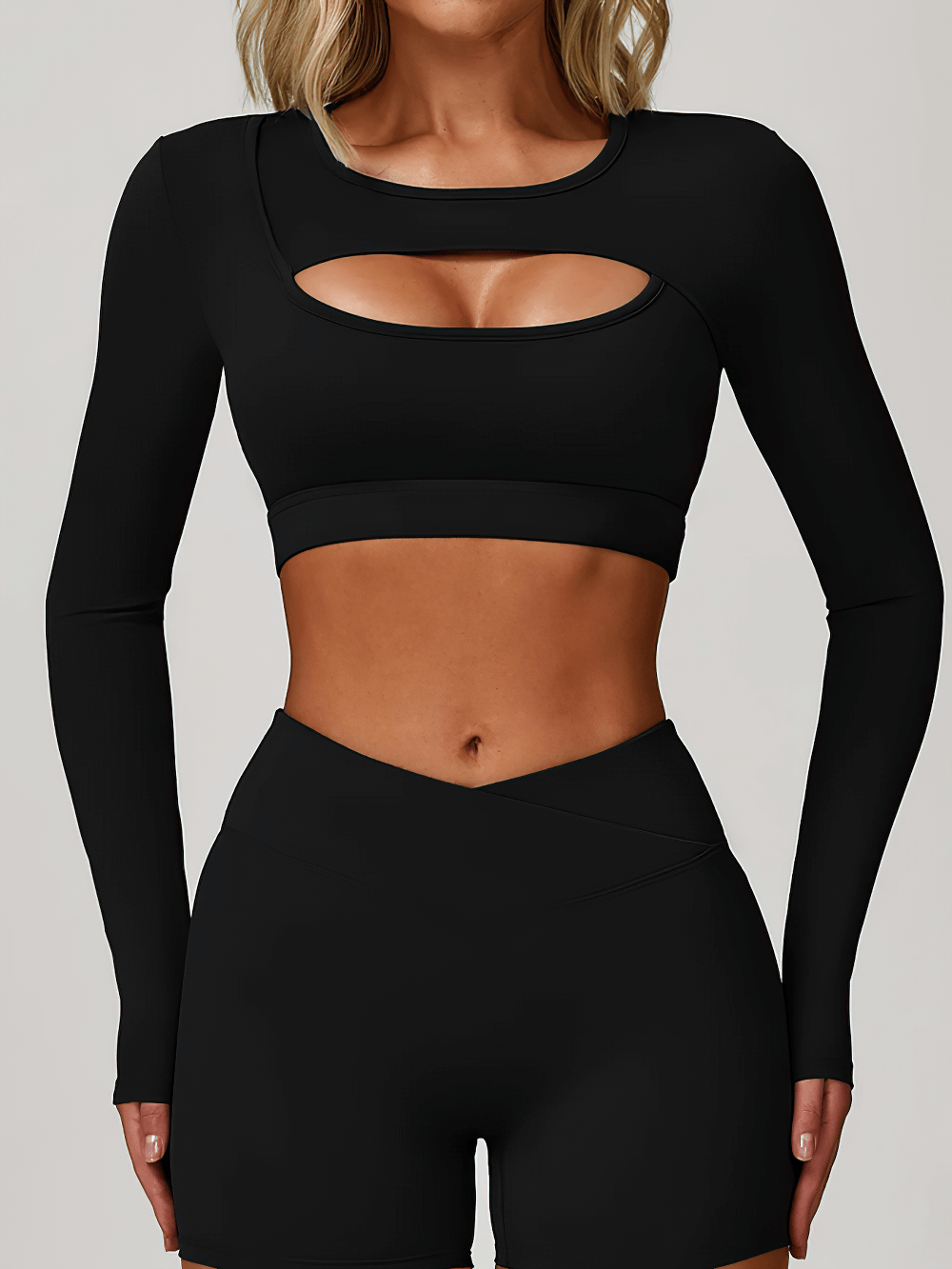 Long sleeve keyhole yoga crop top with V-waist shorts, back view, removable pads detail.