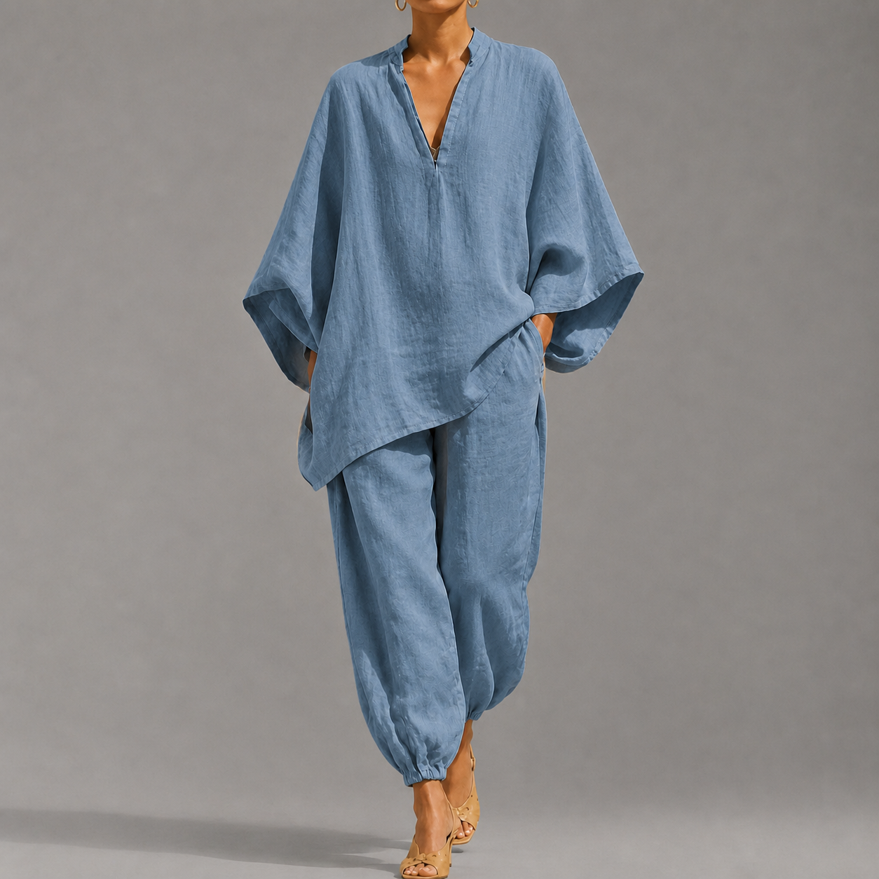 Women's loose, casual summer two-piece set featuring a notched-collar, batwing-sleeve top and trousers; lightweight and comfortable.