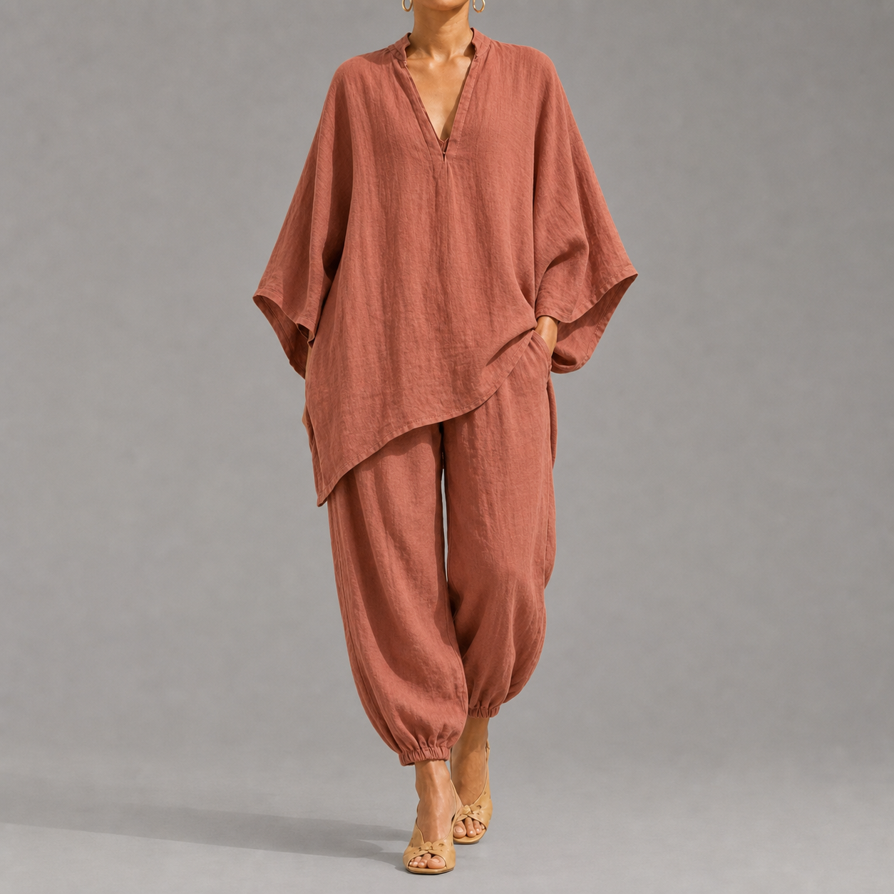 Women's loose, casual summer two-piece set featuring a notched-collar, batwing-sleeve top and trousers; lightweight and comfortable.