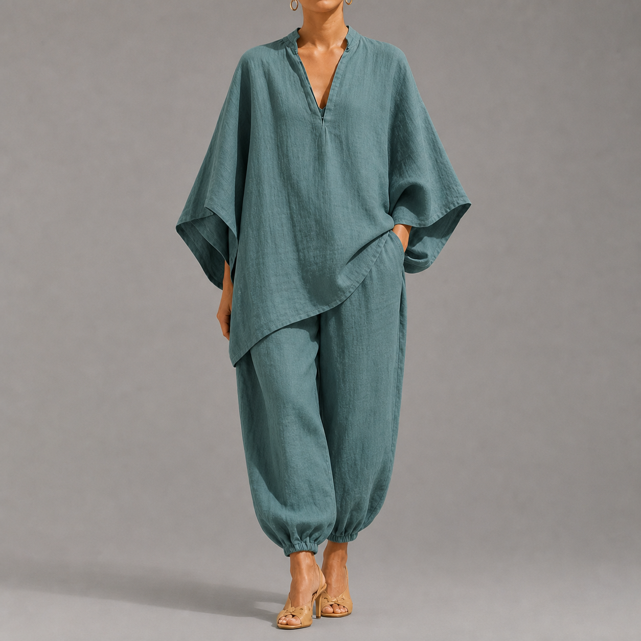 Women's loose, casual summer two-piece set featuring a notched-collar, batwing-sleeve top and trousers; lightweight and comfortable.