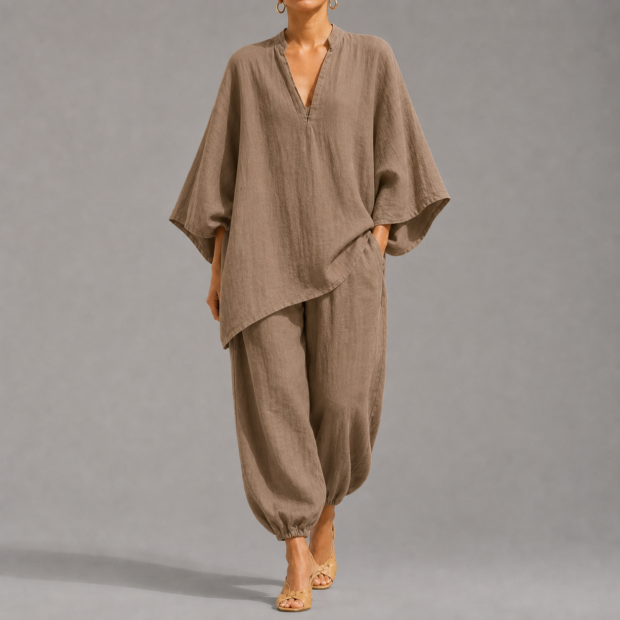 Women's loose, casual summer two-piece set featuring a notched-collar, batwing-sleeve top and trousers; lightweight and comfortable.
