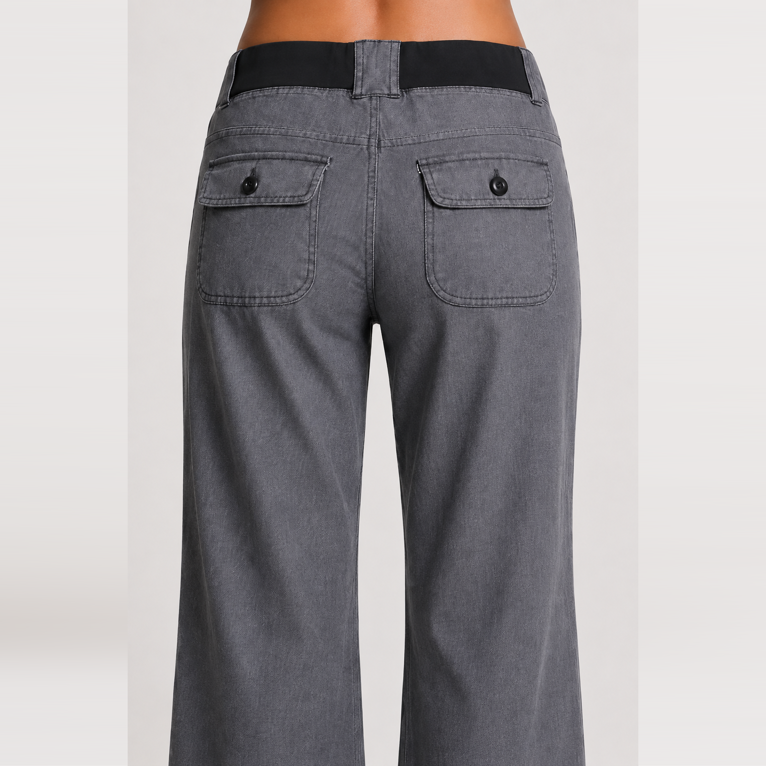 Women's low-rise wide-leg cargo pants featuring flap pockets and Y2K-style bow ties