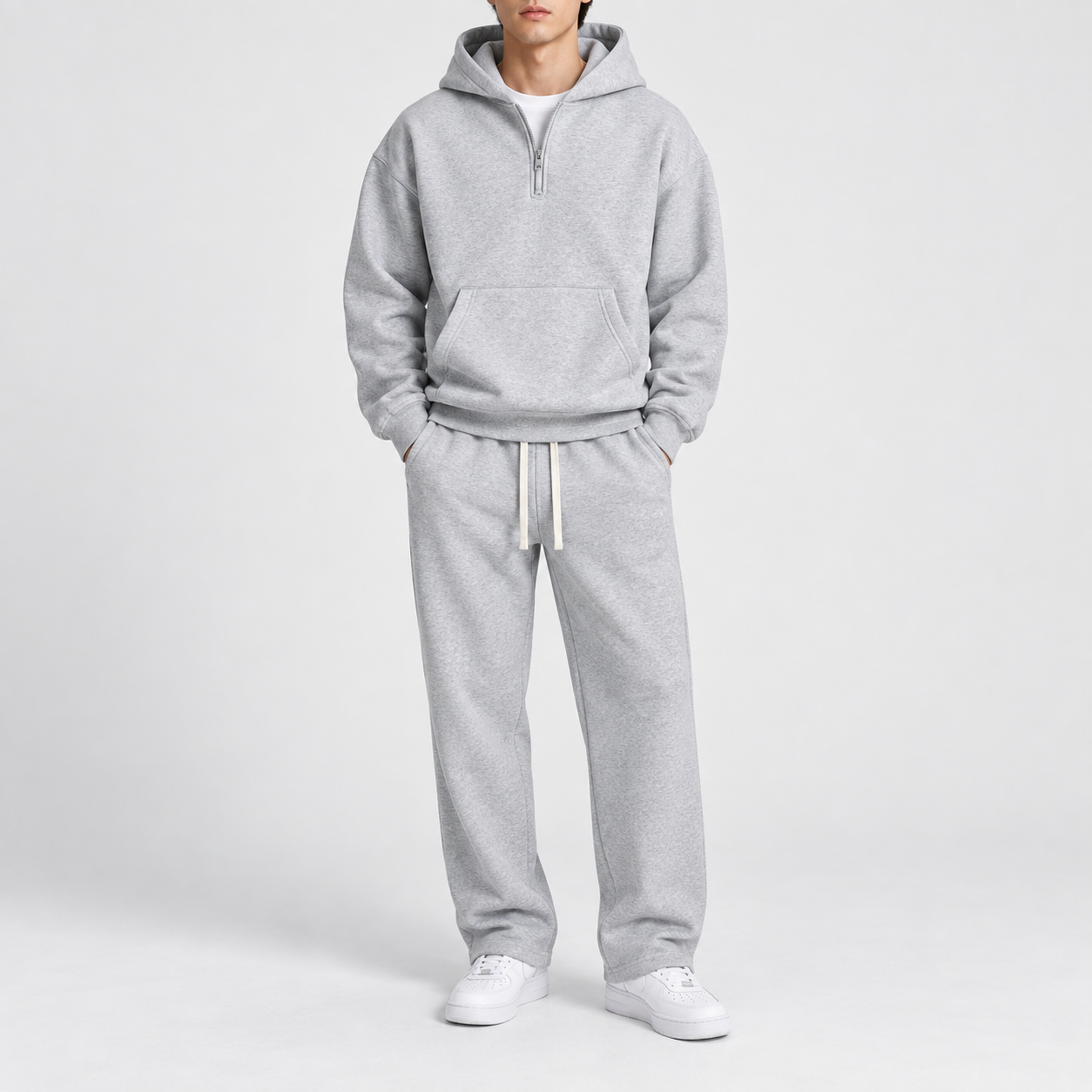 Men's solid-color two-piece casual sportswear set featuring a regular-fit, drop-shoulder, half-zip hoodie.