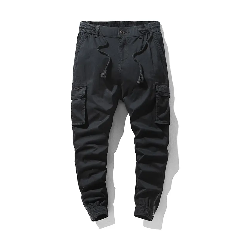 Stylish solid-color cargo pants featuring an elastic drawstring design, multiple pockets, and multiple flap details