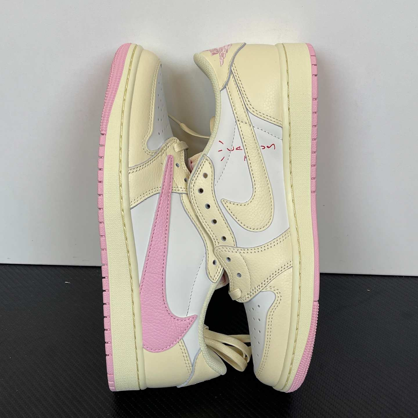 Travis Scott x Air Jordan 1 Low OG SP “Sail Pink” Reverse Swoosh Low-Top Sneakers