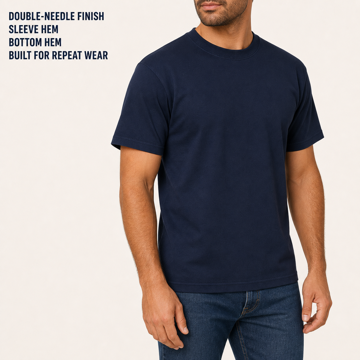Model-worn double-needle sleeve and bottom hem detail in navy