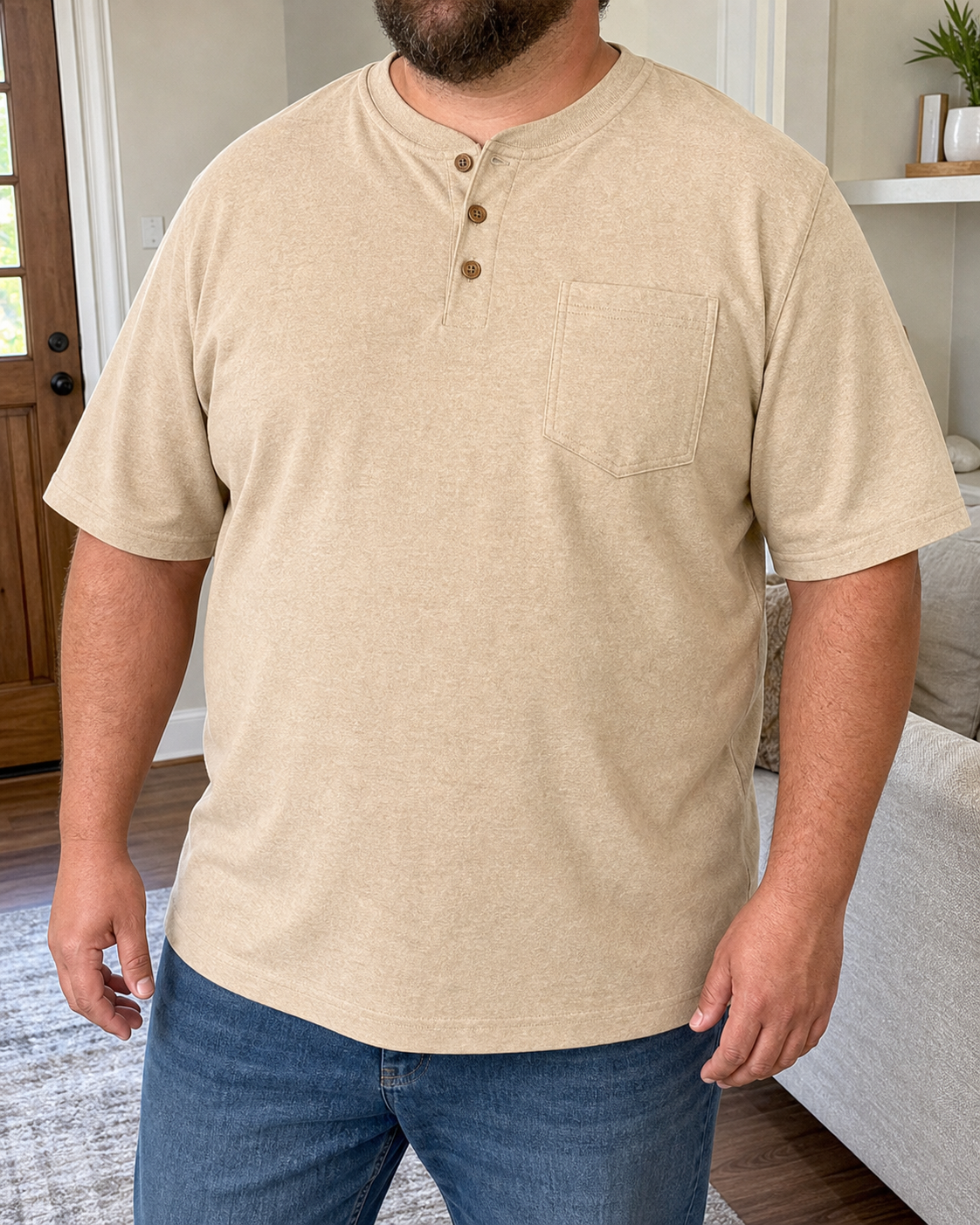 Plus-size model wearing the desert sand three-button pocket Henley in a bright home entry