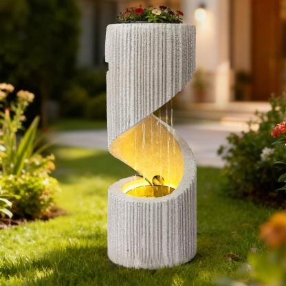 Fuente moderna con cascada de columna en espiral e iluminación LED para la decoración de jardines y patios.