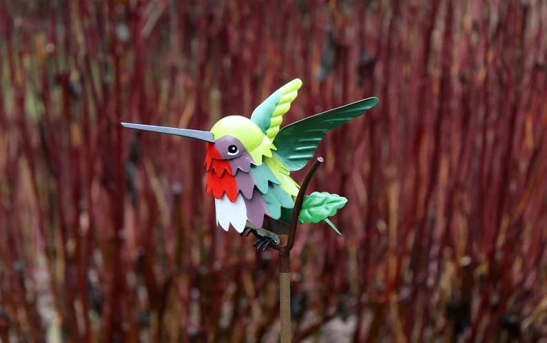 Goldfinch, Cardinal, Western Bluebird, Ruby-throated Hummingbird on a garden stake