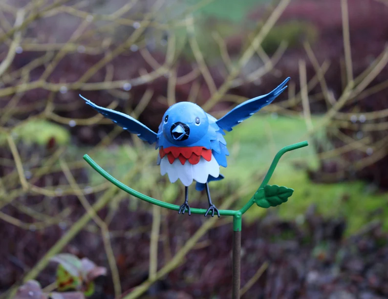 Goldfinch, Cardinal, Western Bluebird, Ruby-throated Hummingbird on a garden stake
