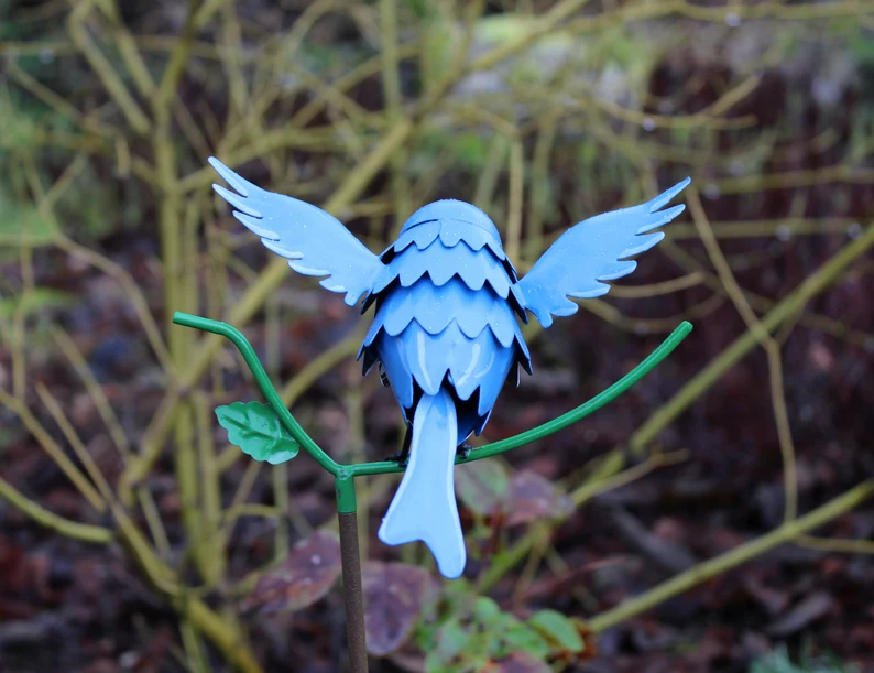 Goldfinch, Cardinal, Western Bluebird, Ruby-throated Hummingbird on a garden stake