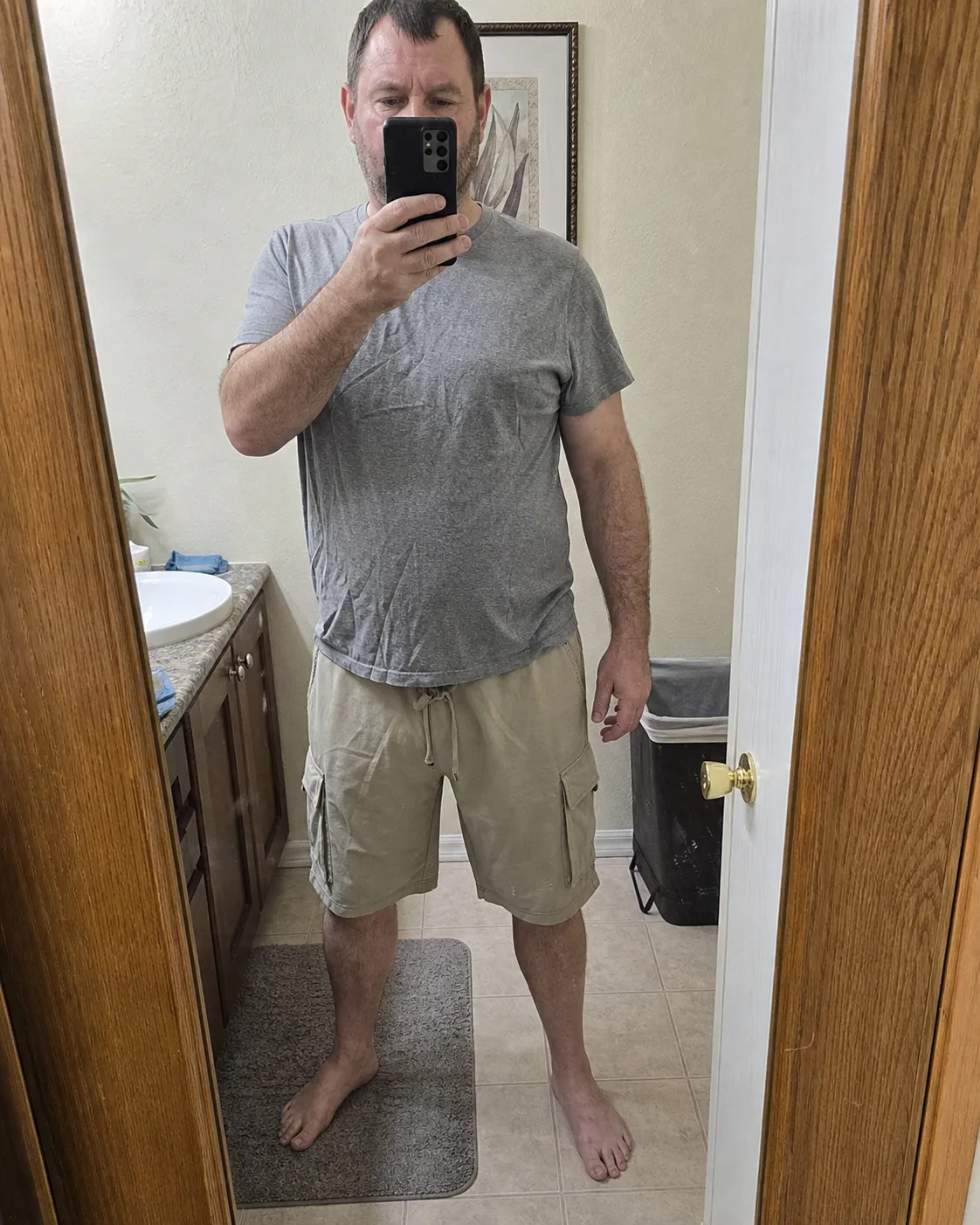 Khaki cargo shorts bathroom mirror try-on