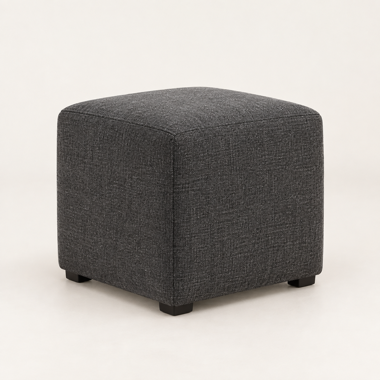 Coal Wool Cube Ottoman on a warm neutral background