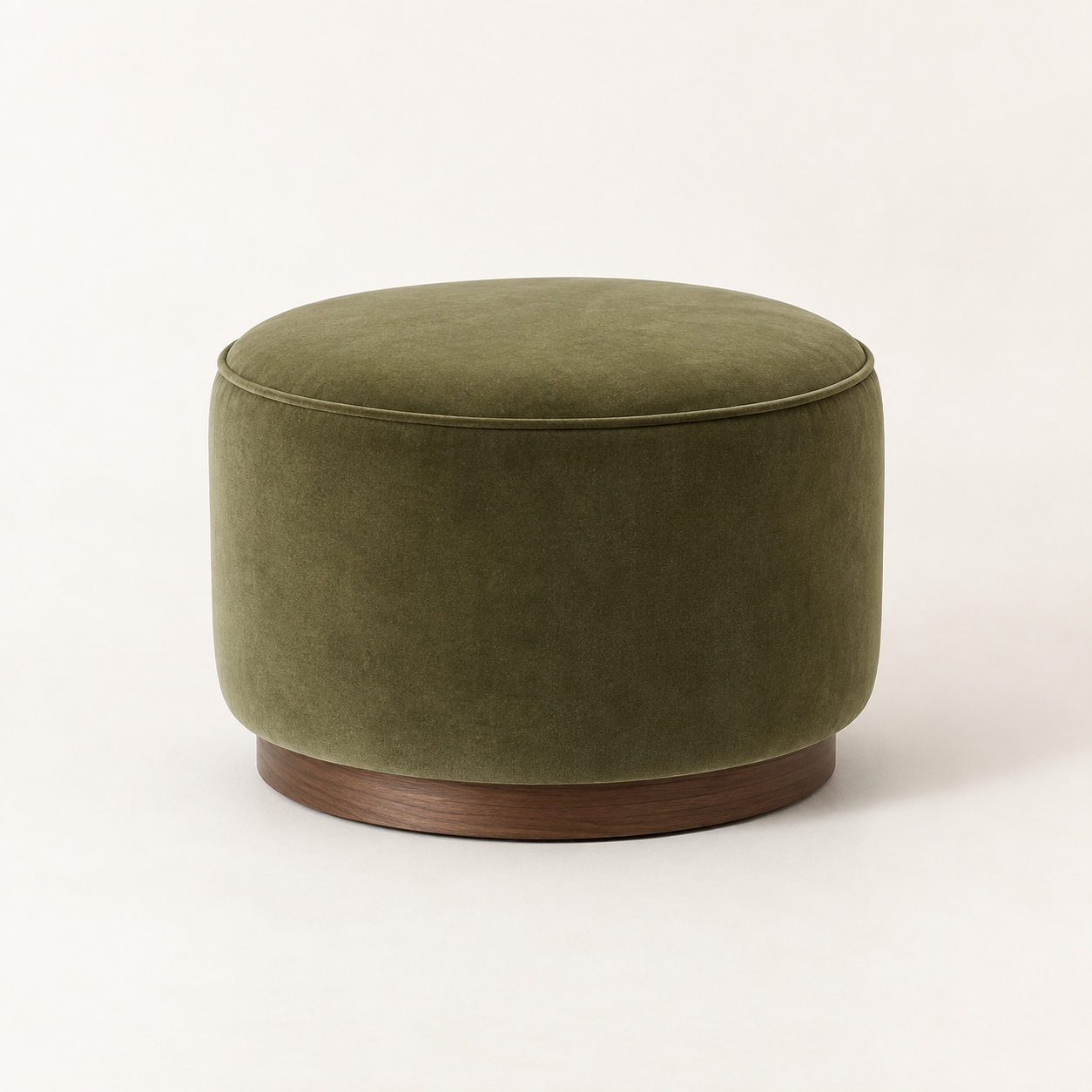 Grove Olive Ottoman on a warm neutral background