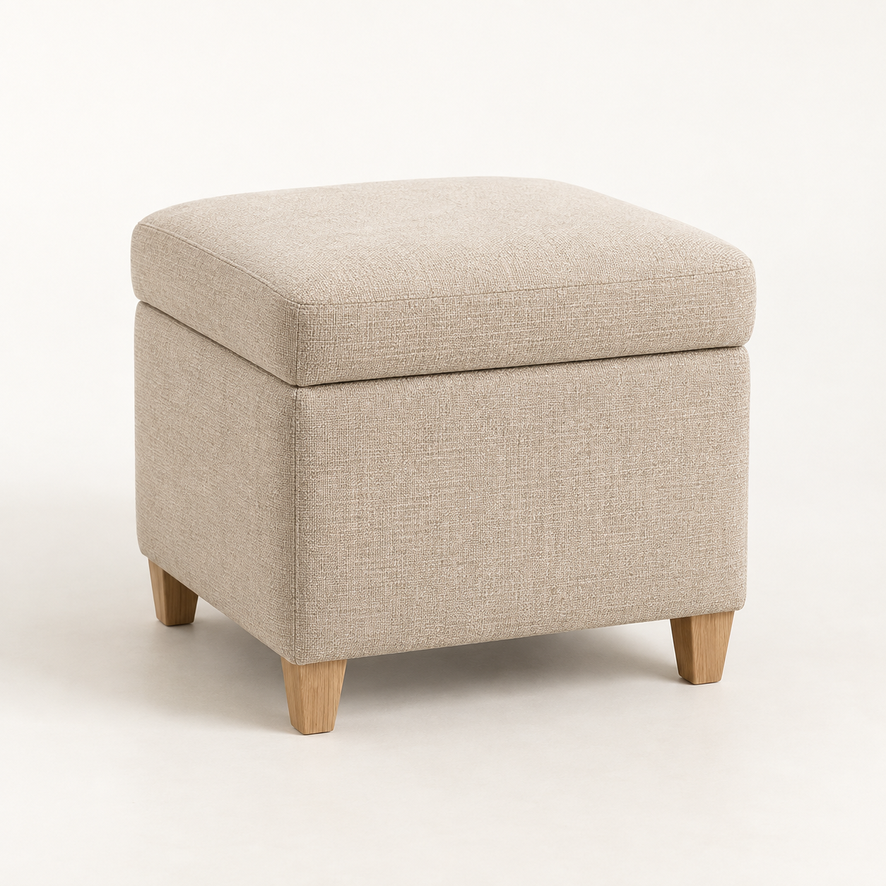Haven Storage Ottoman on a warm neutral background