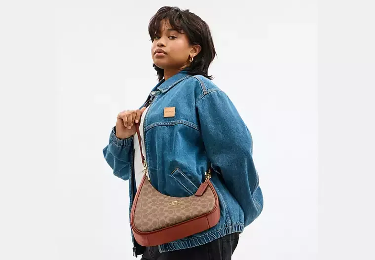 Twisted Teri Shoulder Bag In Signature Canvas