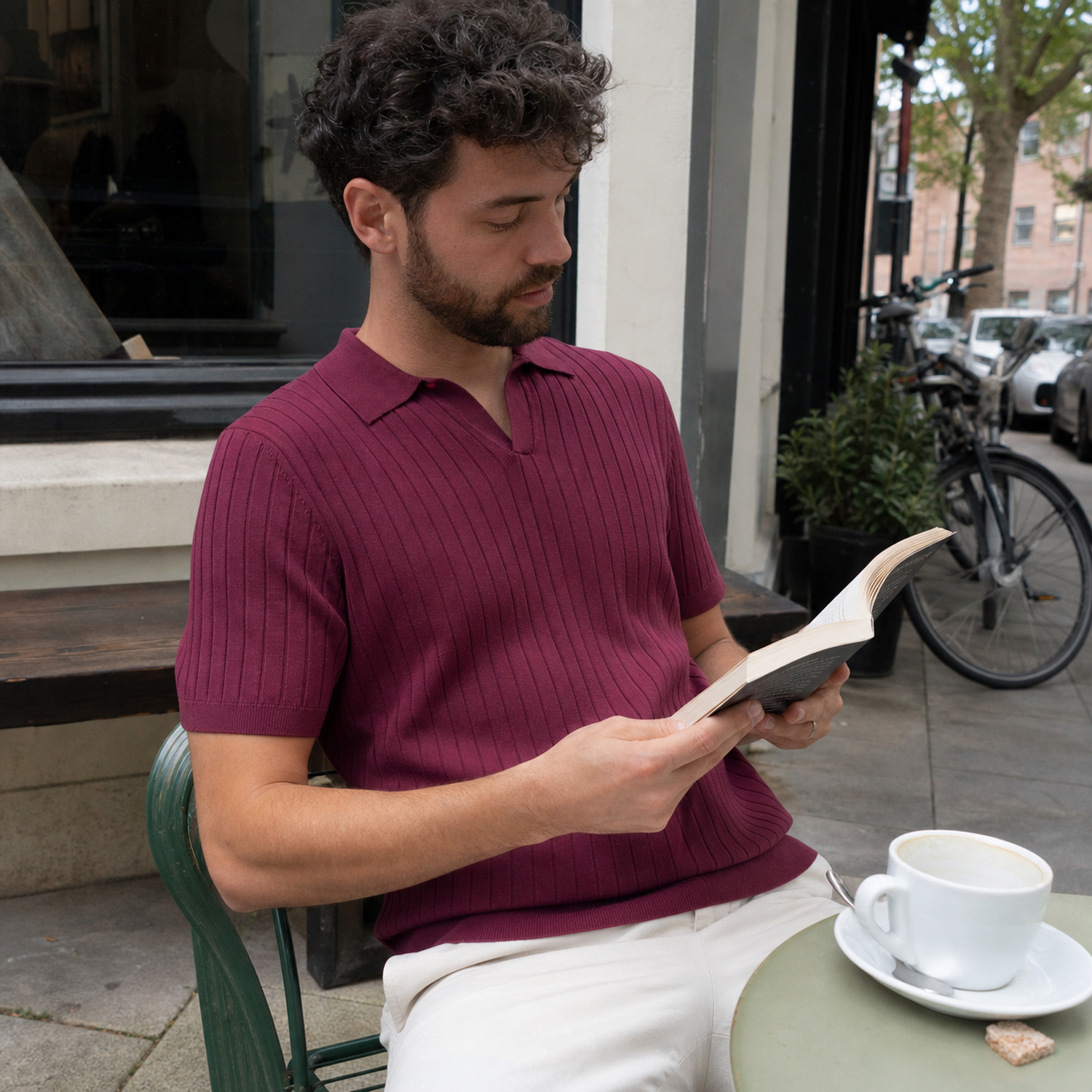 Men's ribbed Johnny collar polo styled for a relaxed cafe visit