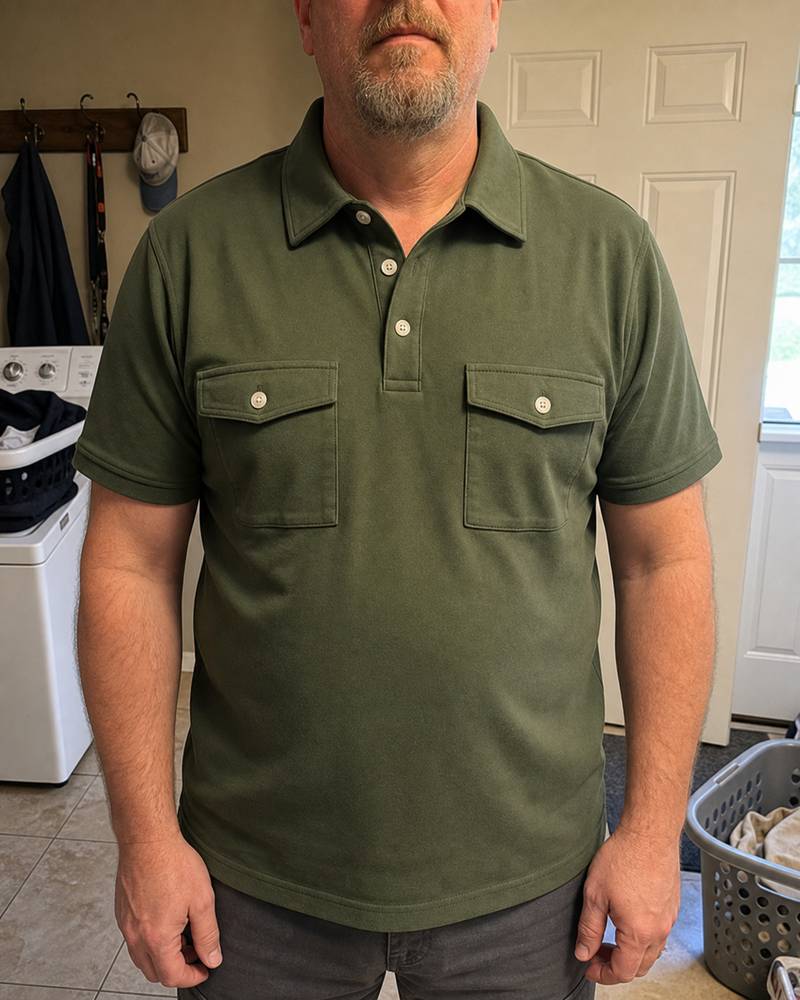 Olive utility polo photographed in a home laundry room