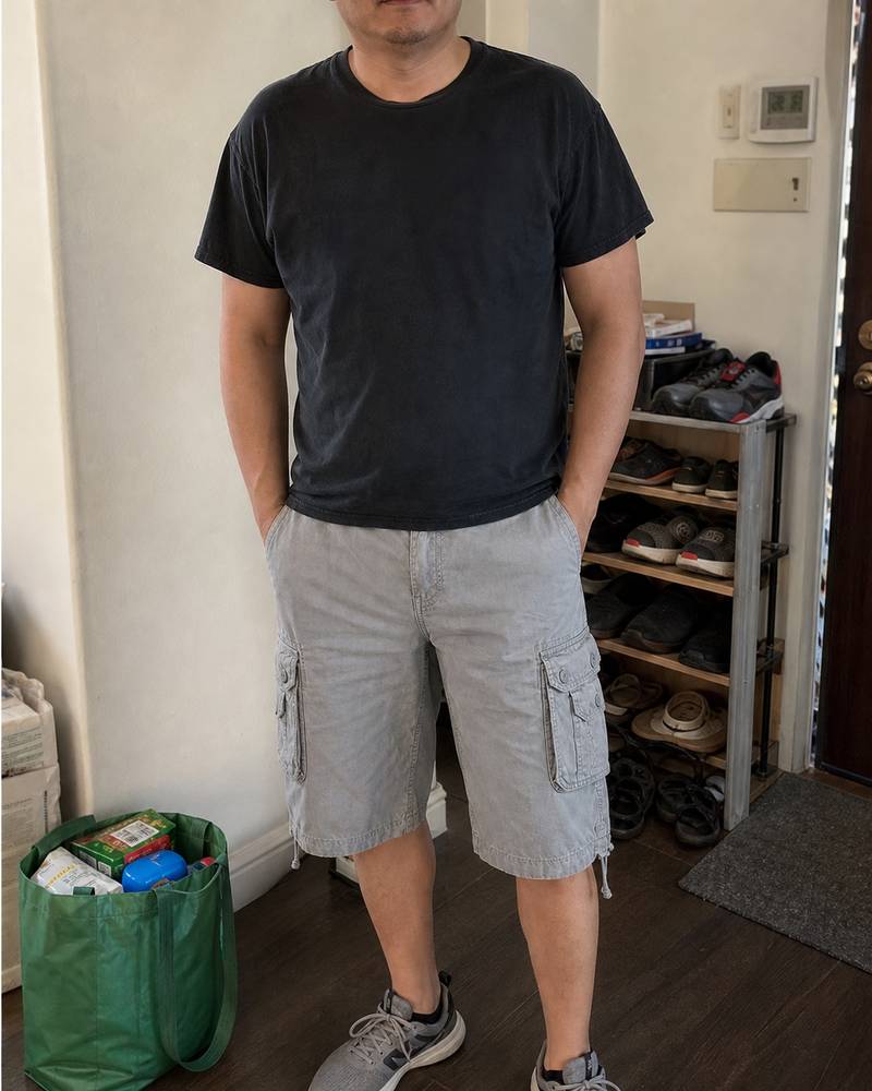 Summer loose fit cargo shorts photographed in a home entryway
