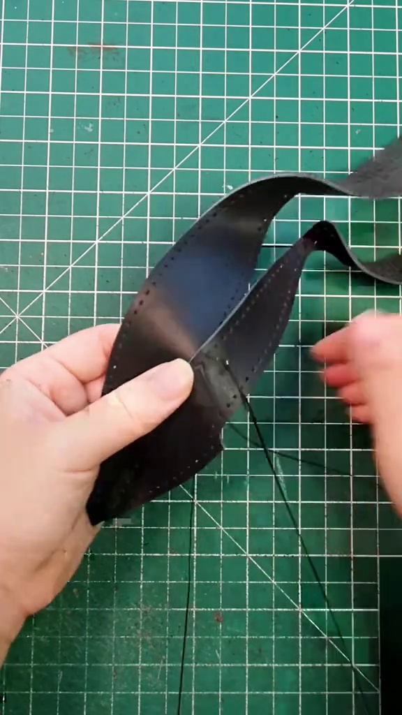 Leather wings formed for the sculptural bat silhouette