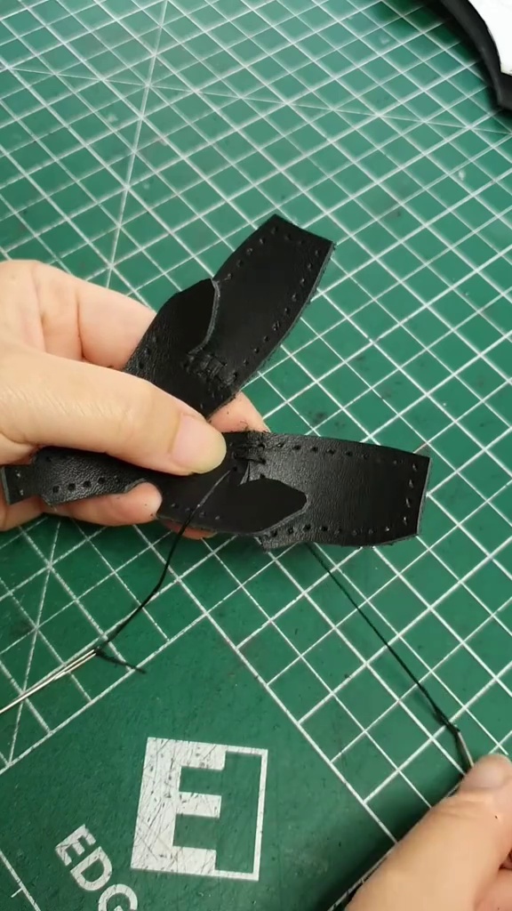 Stitch details joining the leather body sections