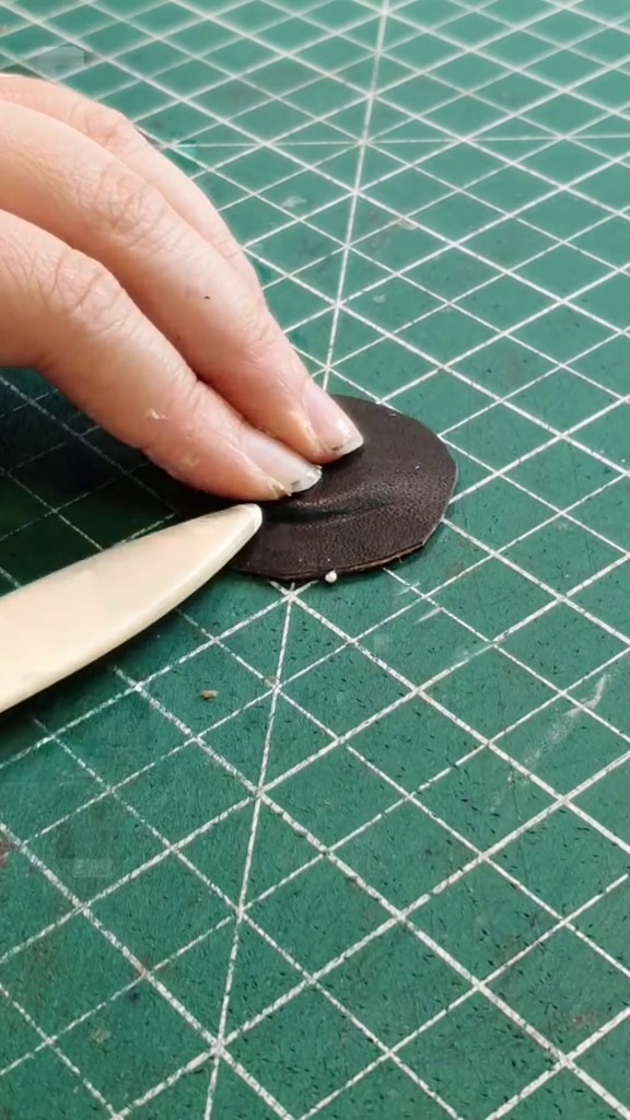 Leather edge finishing detail for the bat purse pieces
